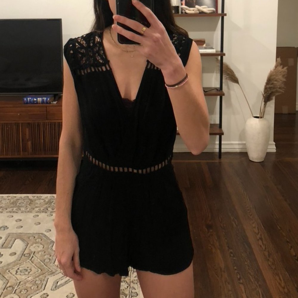 Mini black romper with lace detail and open back
